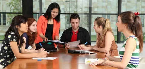 Student using laptop to buy assignment online in NZ easily and quickly.